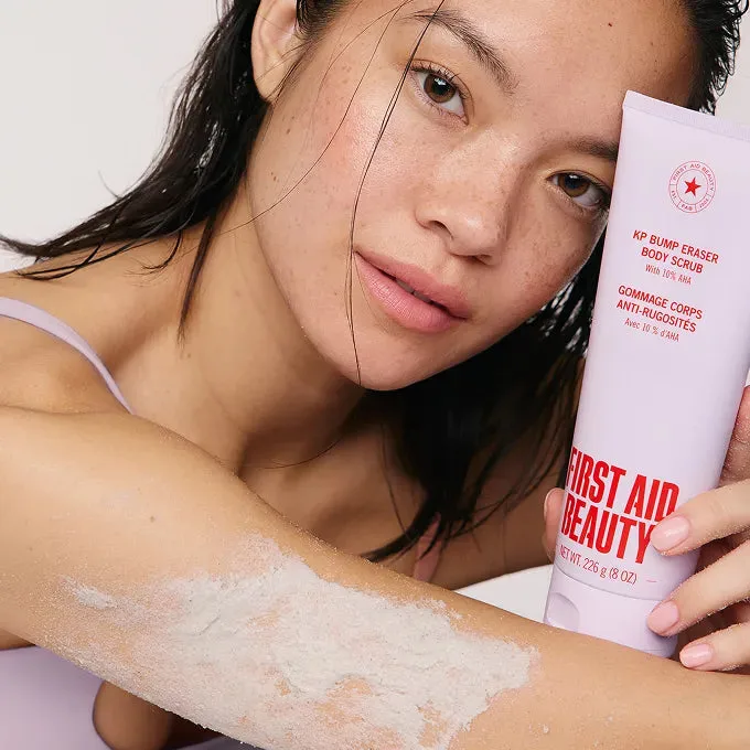Model using First Aid Beauty KP Bump Eraser Body Scrub on her arm