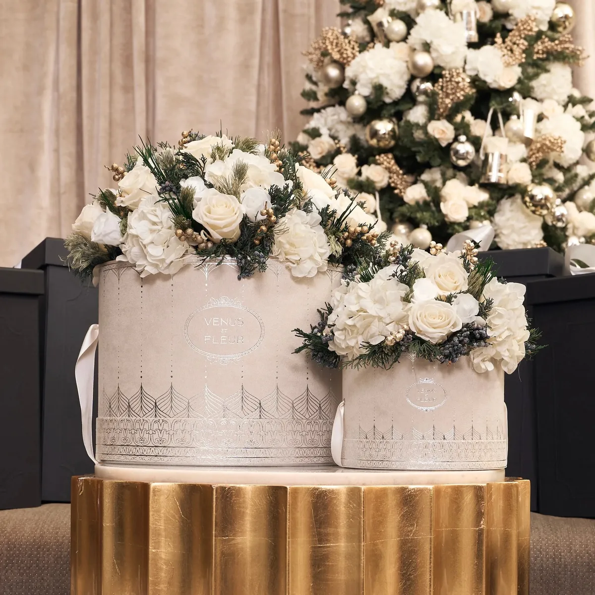 Cream suede Déco Délicate holiday hatboxes embossed in metallic silver