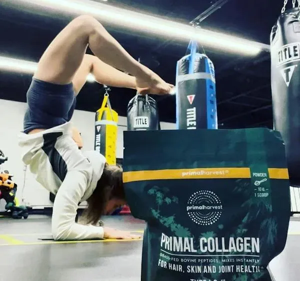 Woman doing a backbend in the gym with Primal Collagen, accompanying Joy E. L.’s review