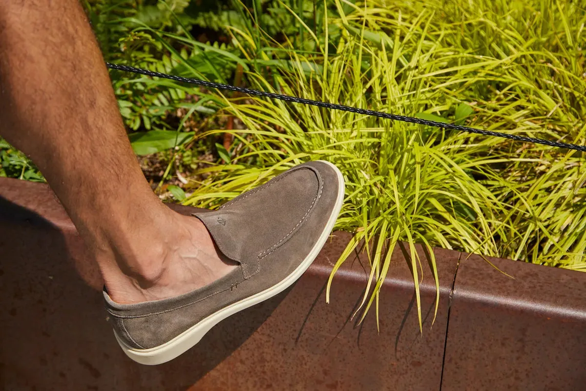 Amberjack grey dress shoes worn with tailored trousers outdoors
