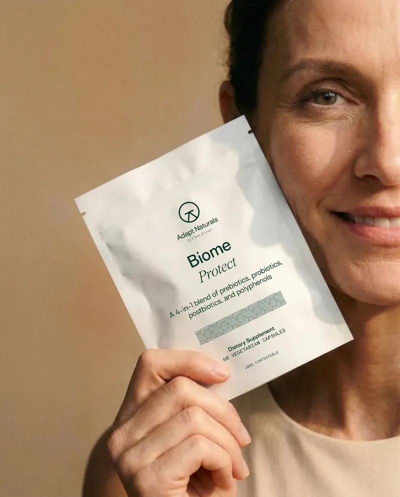 Woman holding Biome Protect by Adapt Naturals