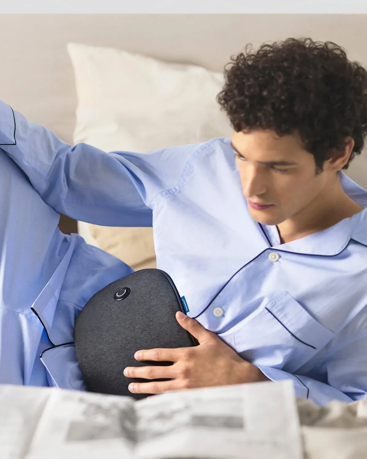 A man relaxing with Embrace against his abdomen
