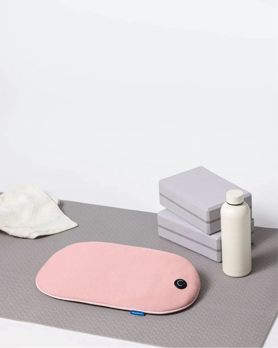 Embrace Heating Pad beside yoga blocks