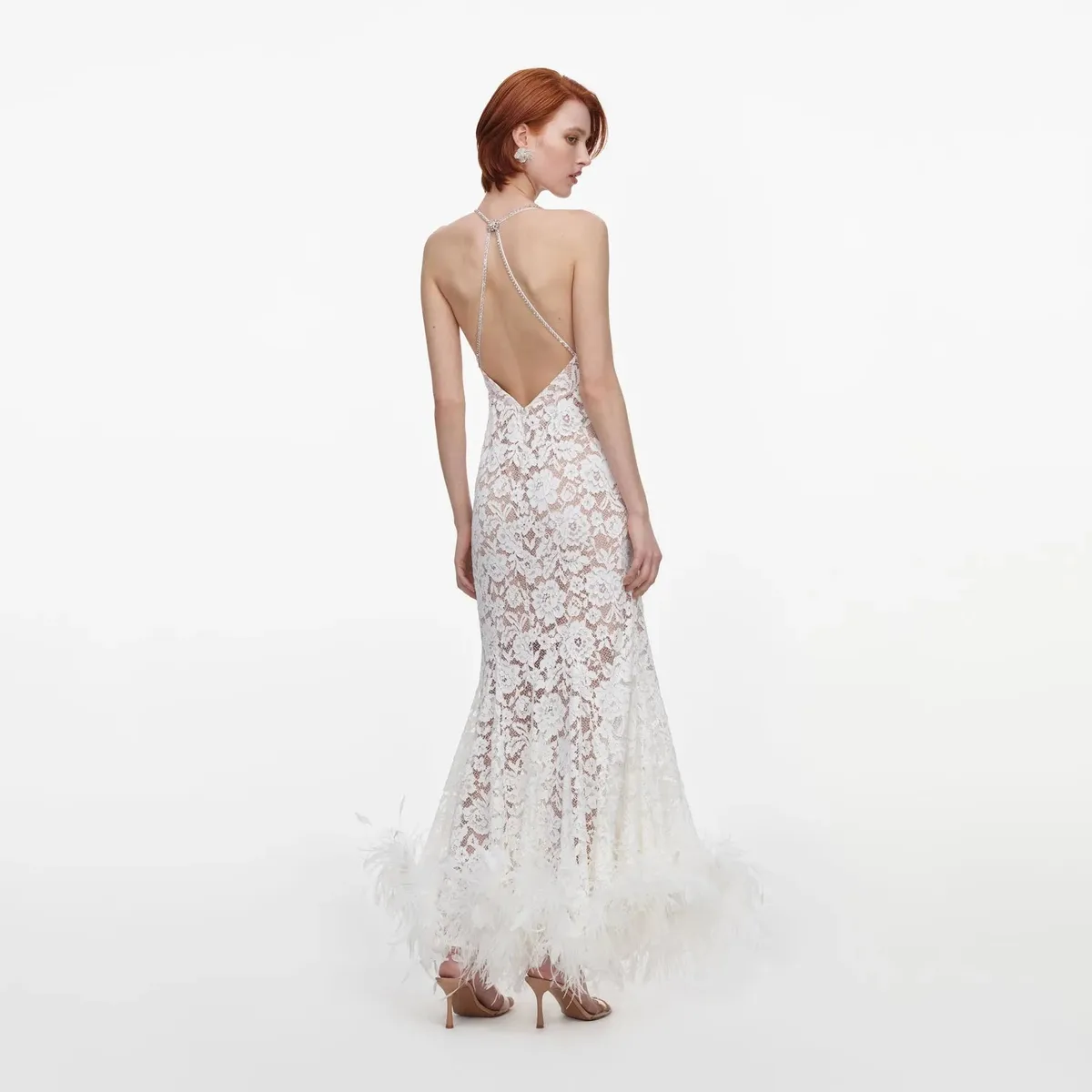 Full-length back view showing the plunging back and feather hem