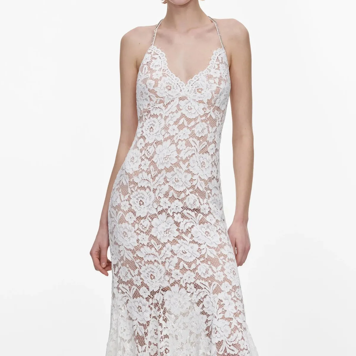 Close-up of the white floral fine lace and neckline