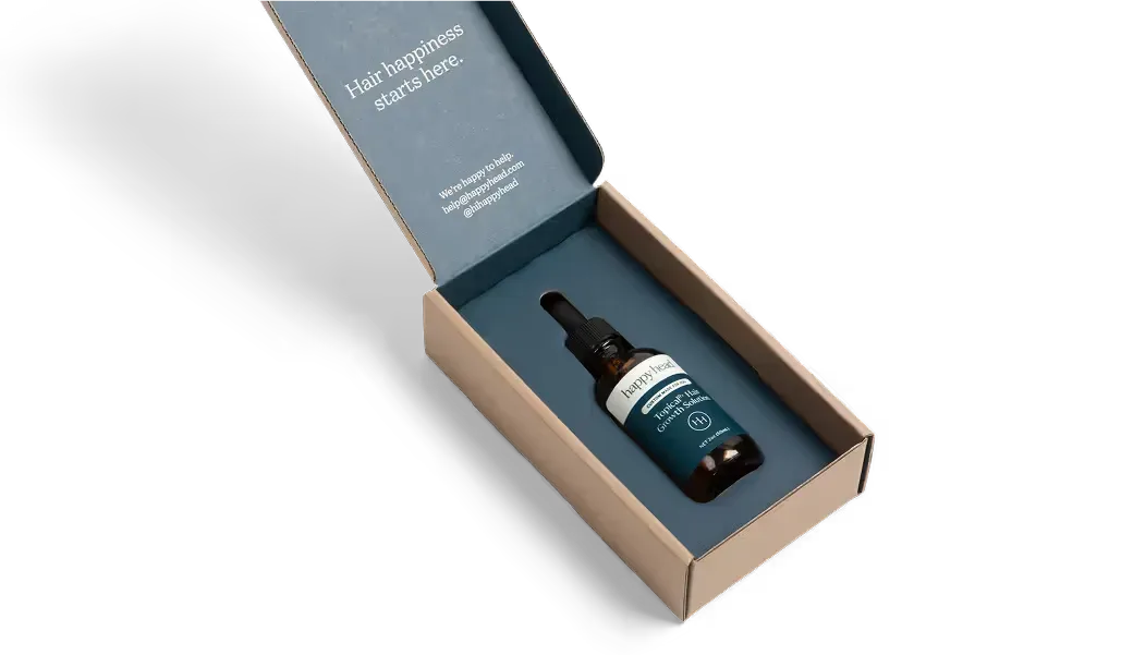Happy Head personalized treatment in its delivery box