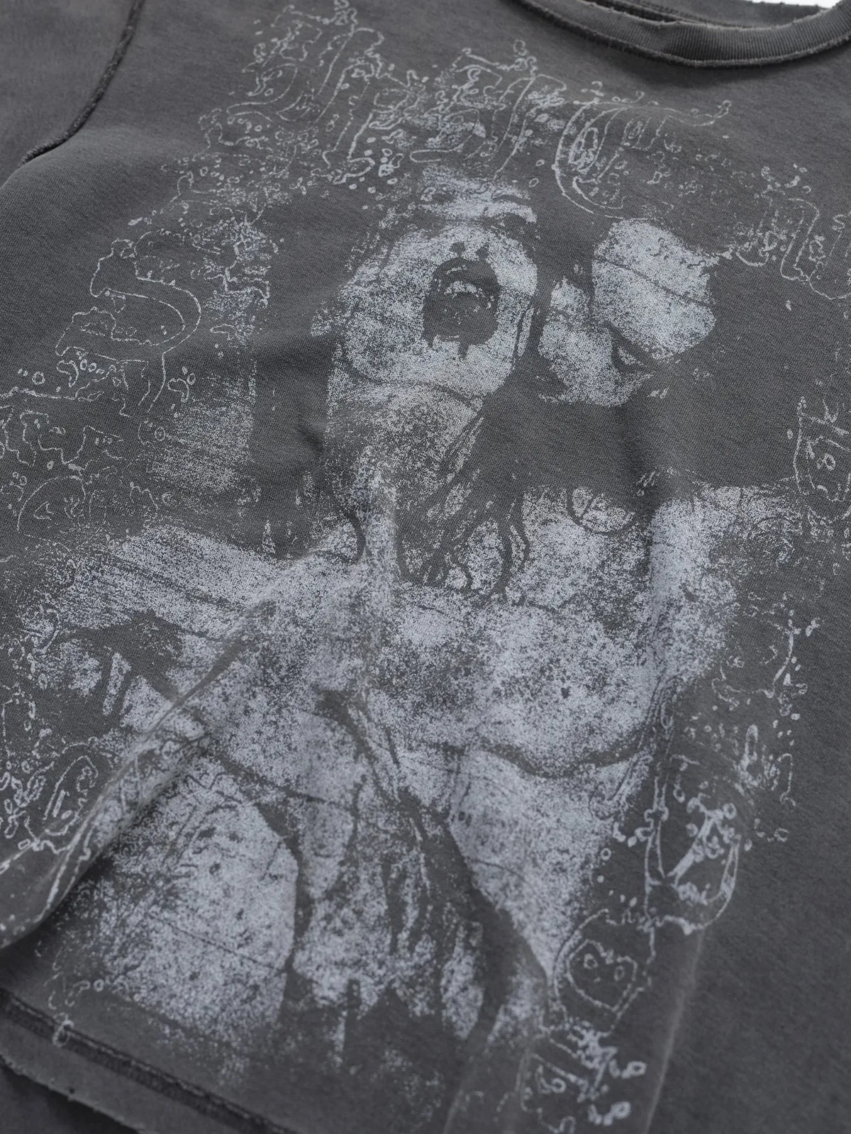 Close-up of the Toxic Boxy T-Shirt graphic, exposed seams and distressed hem