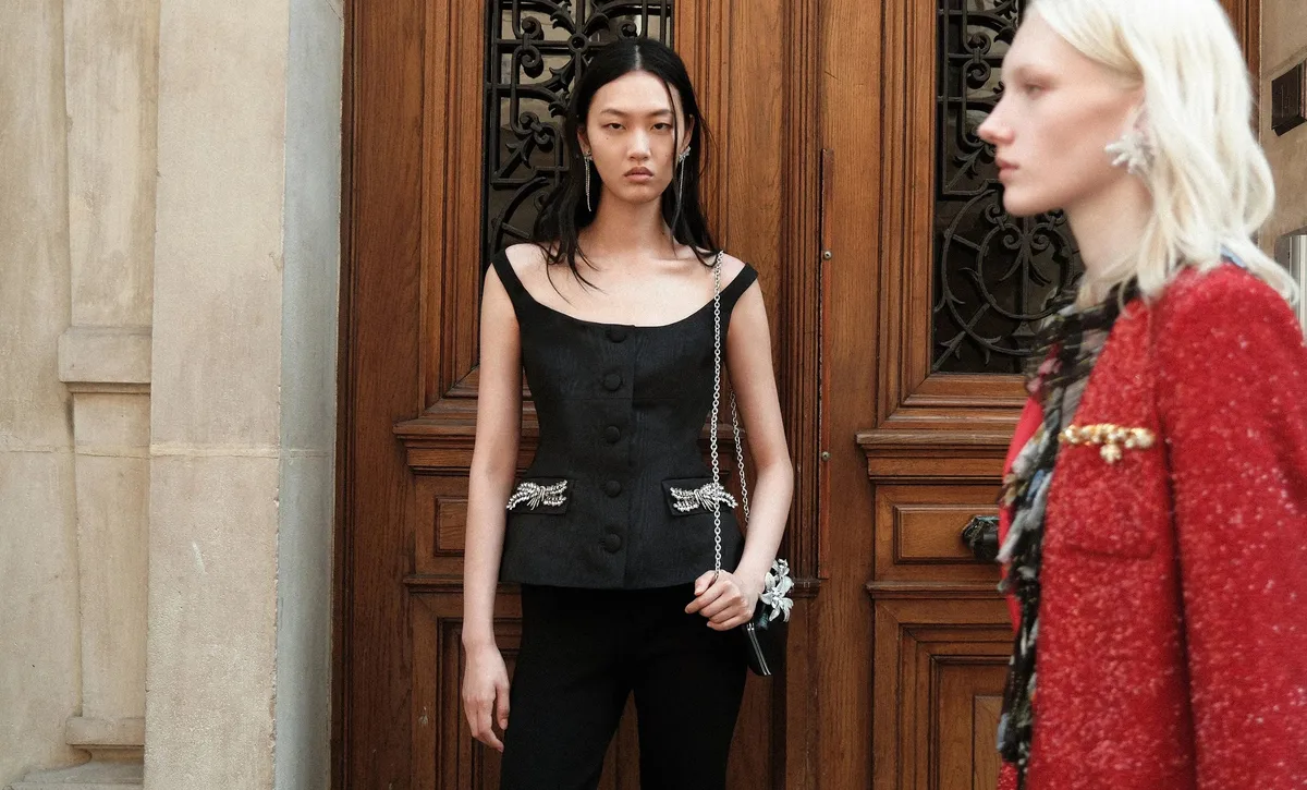 Two Resort 2027 editorial looks with embellished black tailoring and a red sequin jacket