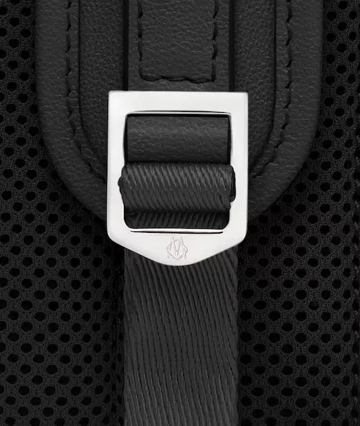 Padded back mesh and adjustable shoulder-strap hardware on the Never Still backpack