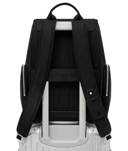 The backpack’s suitcase attachment sleeve fitted over a RIMOWA telescopic handle