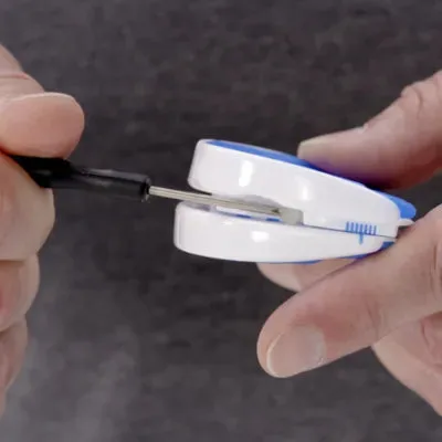 Man using the VitalSleep adjustment tool