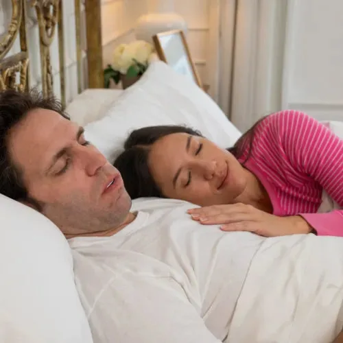 A couple resting together in bed